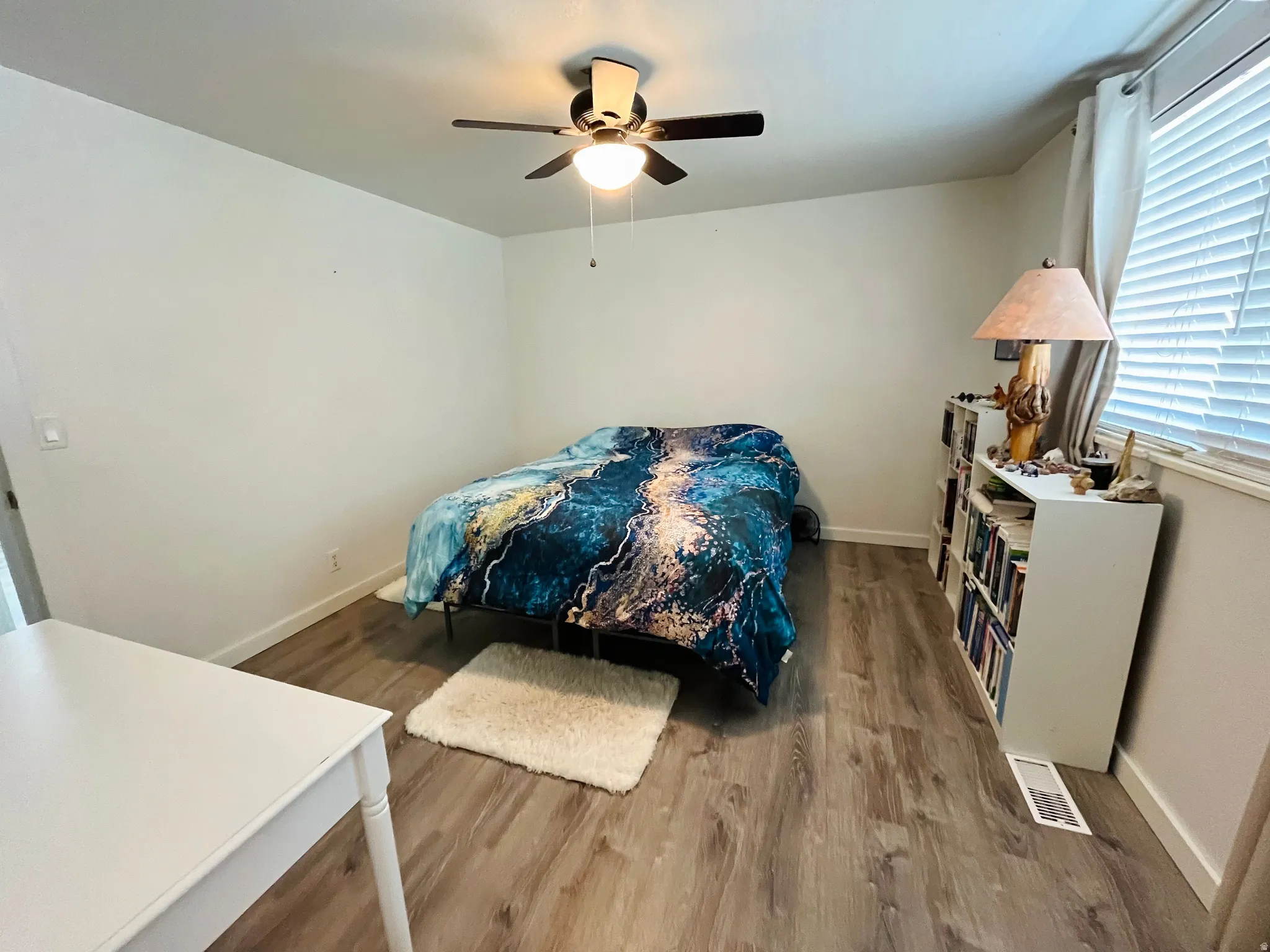 A spacious primary bedroom offering a peaceful retreat, complete with abundant natural light and a calming atmosphere.