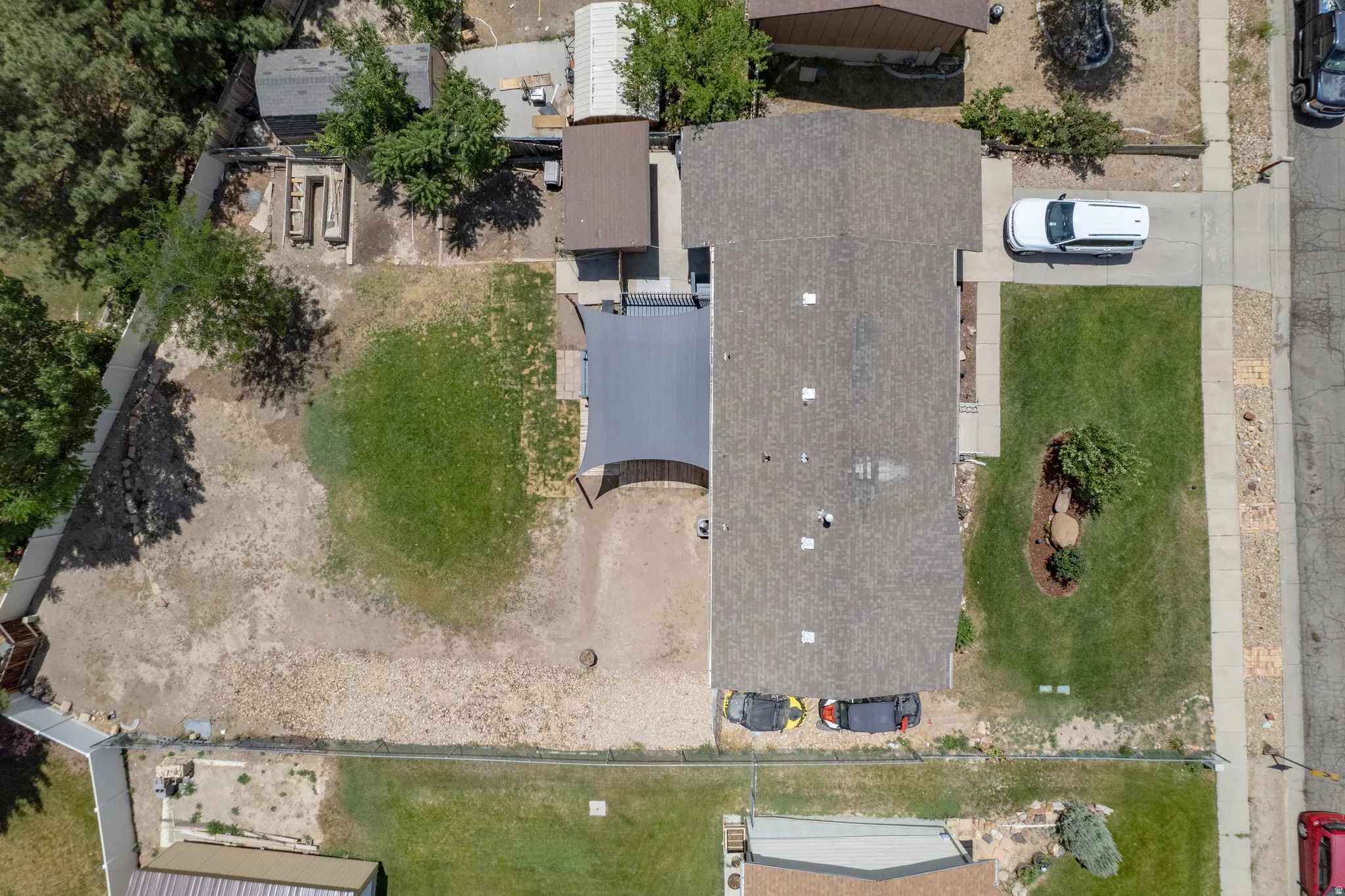 Aerial views showcase the property’s layout, highlighting the home, yard space, and surrounding area.