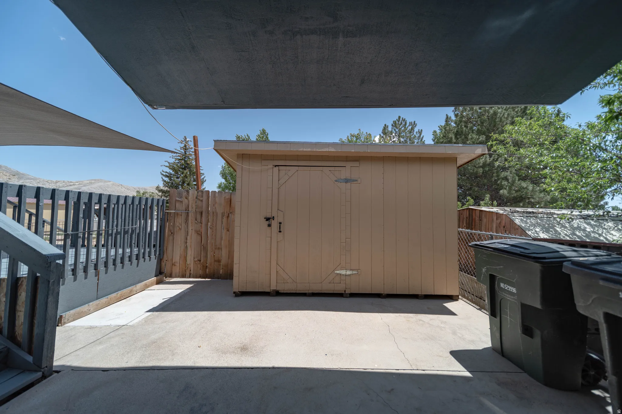 A convenient storage shed provides the perfect space to keep tools, equipment, and seasonal items organized.