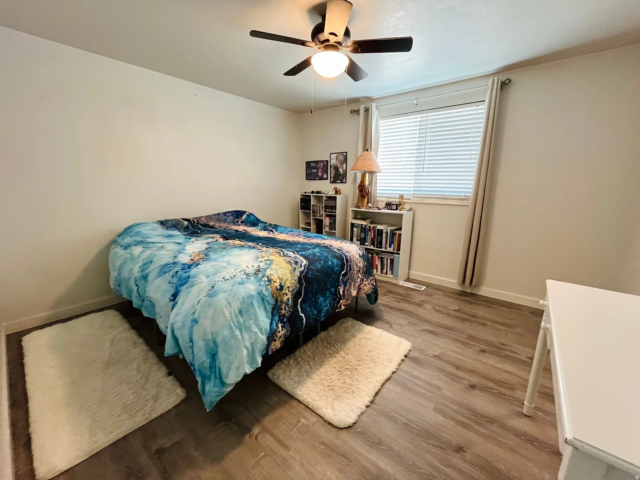 A spacious primary bedroom offering a peaceful retreat, complete with abundant natural light and a calming atmosphere.