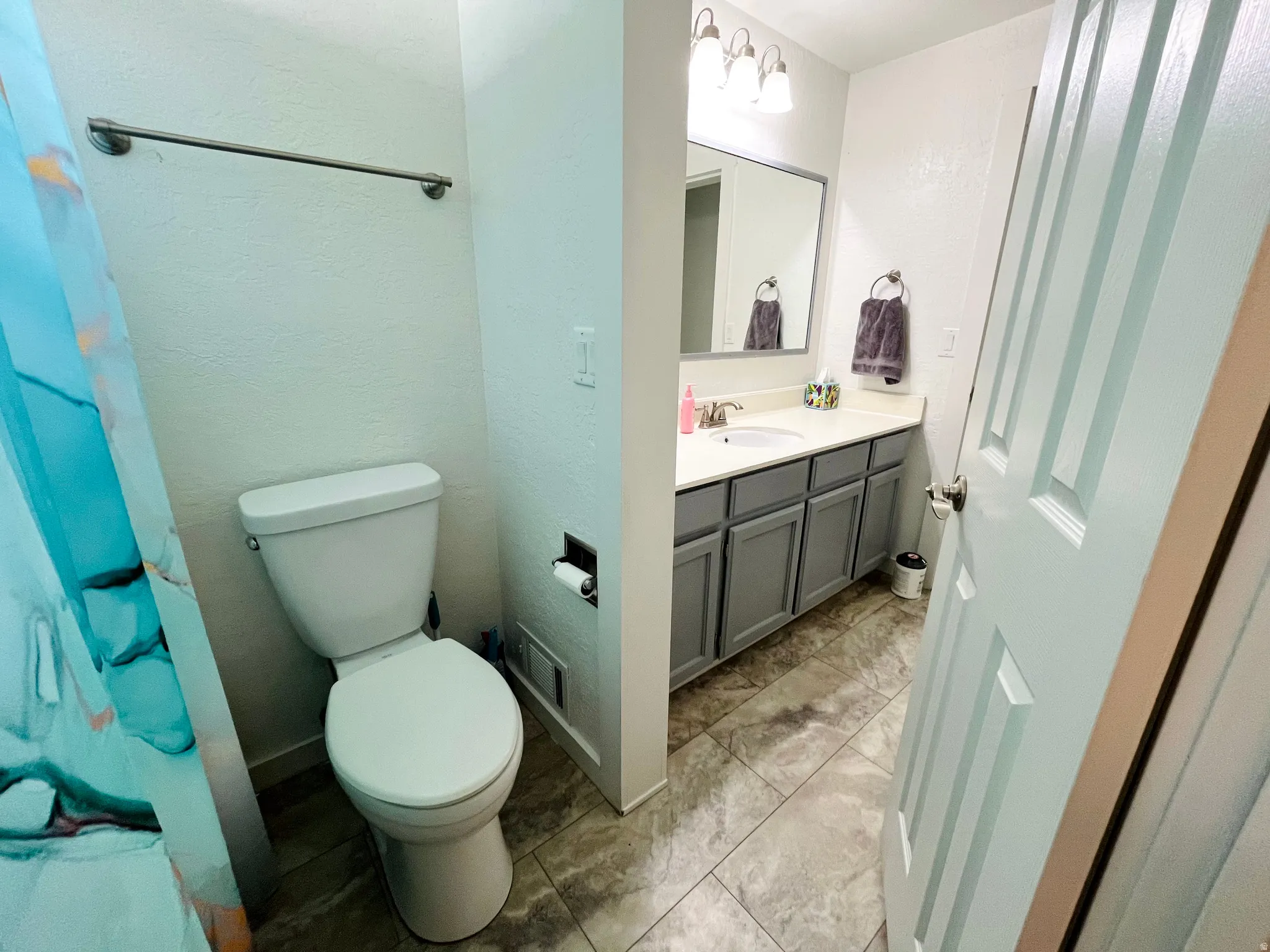 A thoughtfully designed Jack-and-Jill bathroom featuring a full bath setup, offering both privacy and practicality for connected spaces.