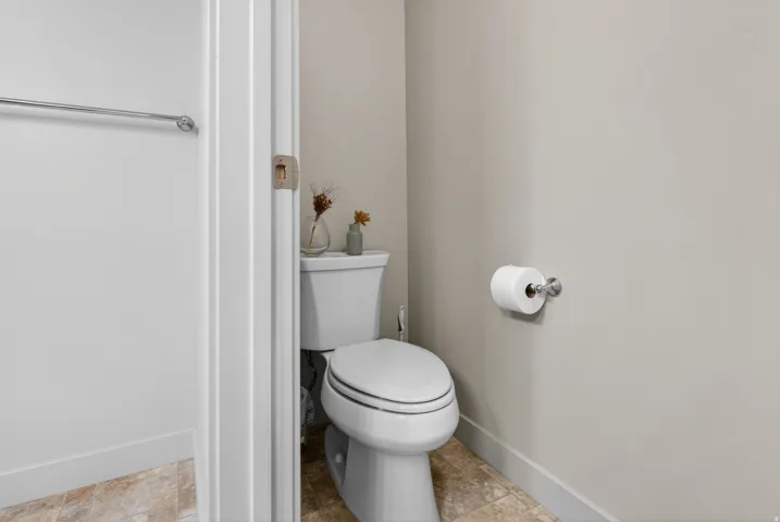White toilet with a round bowl and tank