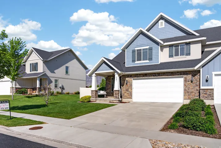 Stone veneer and siding exterior with blue and beige accents