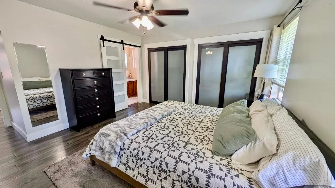 Wood-finish flooring throughout, featuring a ceiling fan with integrated lighting