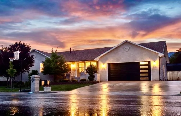 Single-story residence featuring a two-car garage with frosted panel inserts