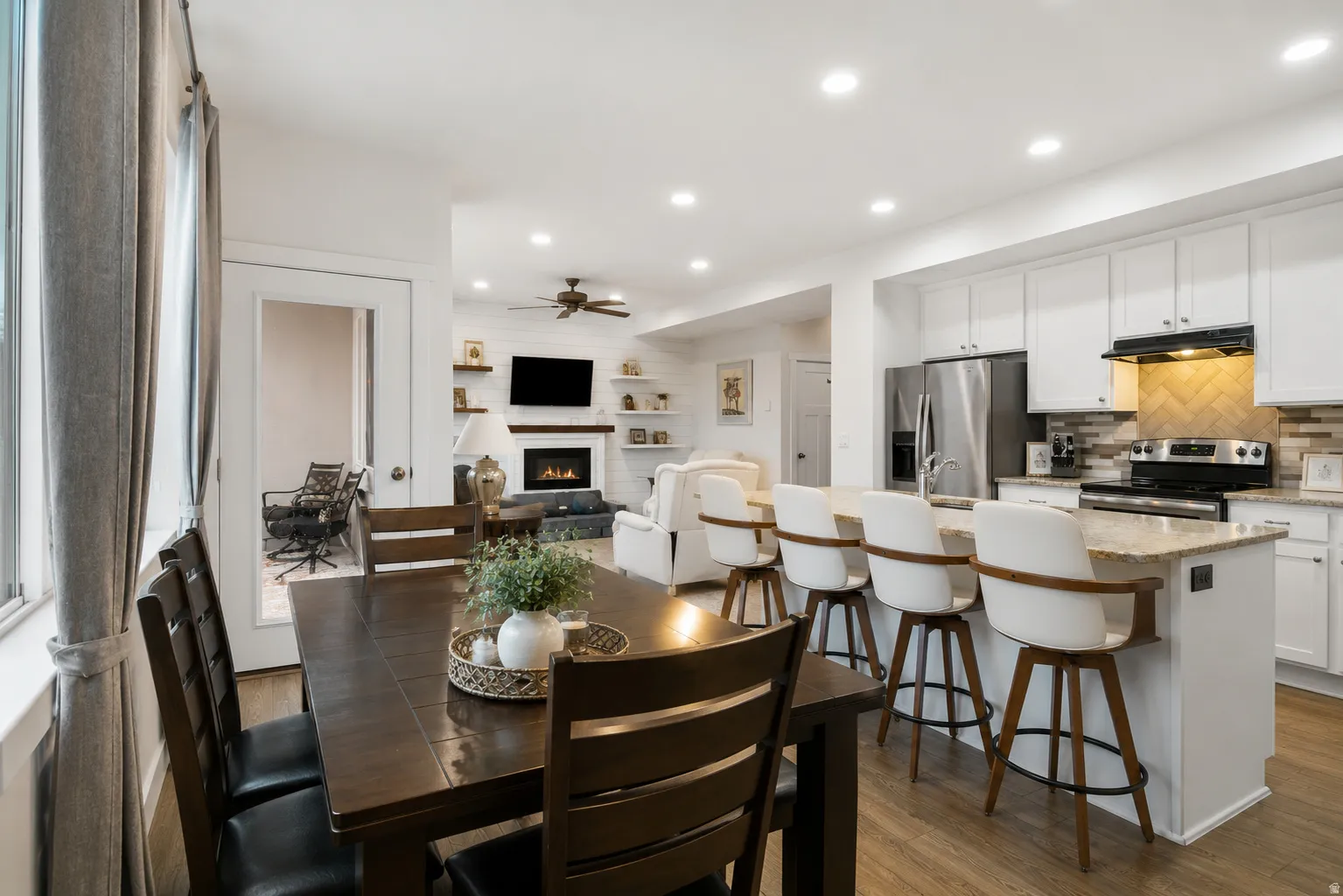 Open-concept main living area with wood-finish flooring