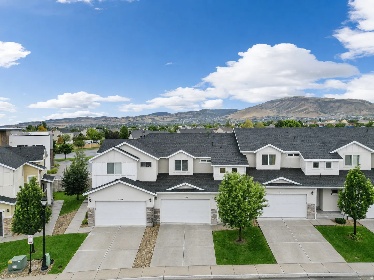 Contemporary townhome community featuring a consistent architectural style