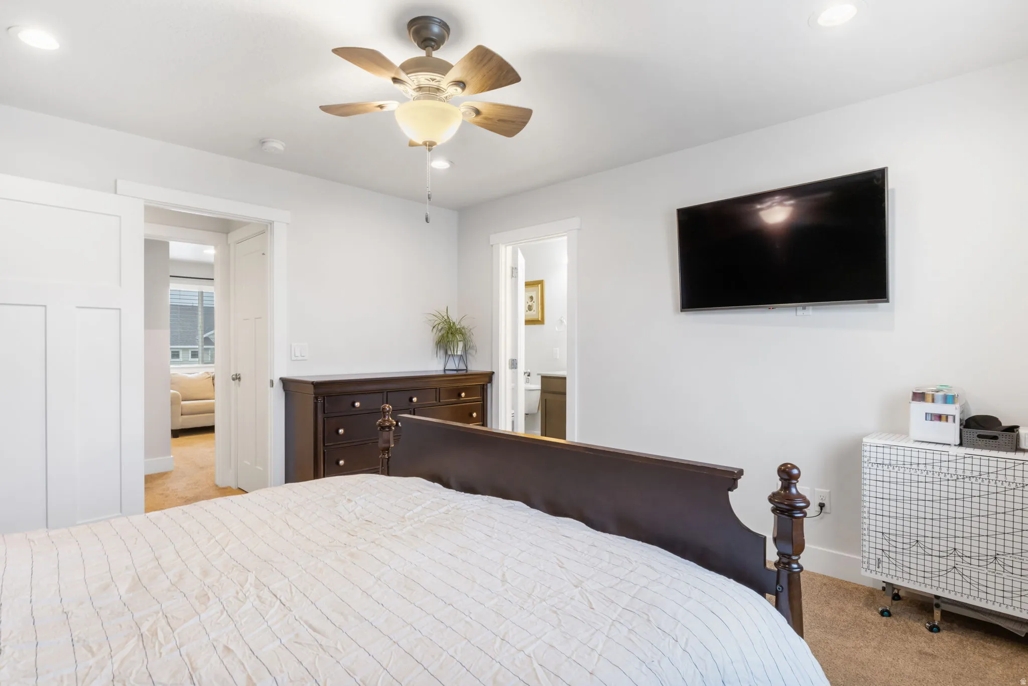 Bedroom featuring a ceiling fan with light, recessed lighting, and soft carpet flooring