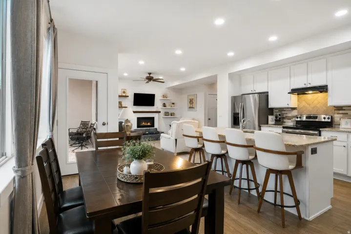 Open-concept main living area with wood-finish flooring