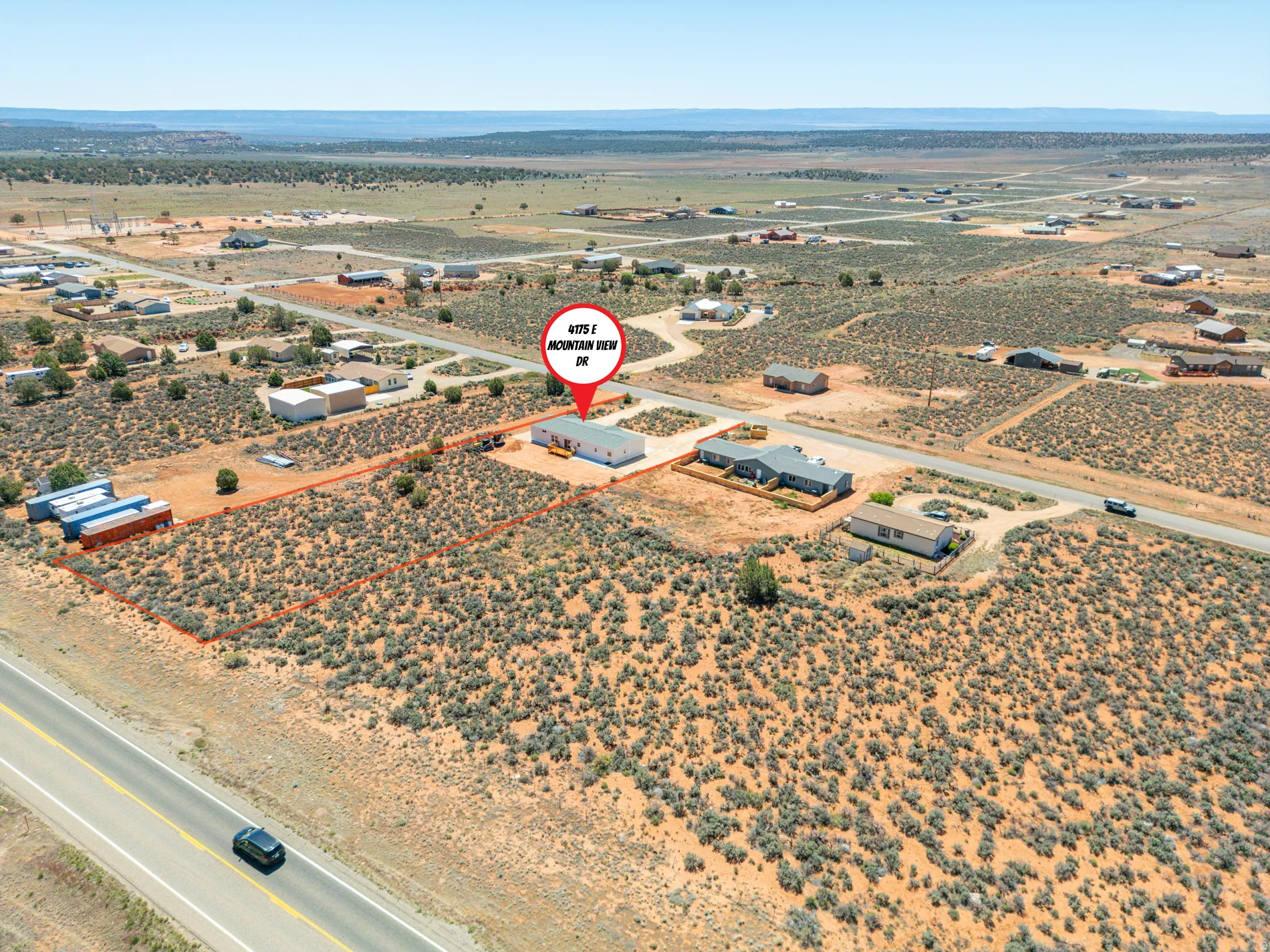 Expansive desert property with a visible road frontage