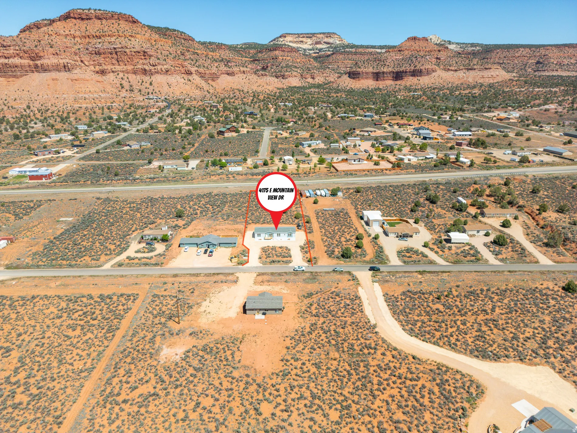 Expansive desert landscape with multiple building sites