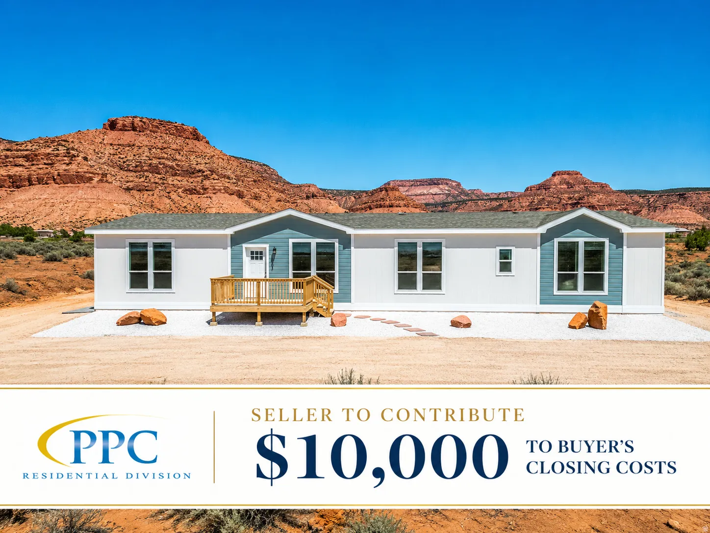 Modern manufactured home featuring a light gray roof, white siding, and blue accent panels