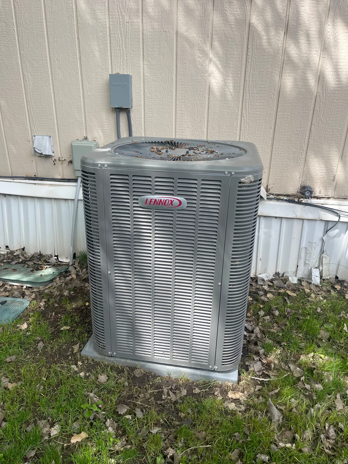 Lennox HVAC unit providing climate control, situated on a concrete pad