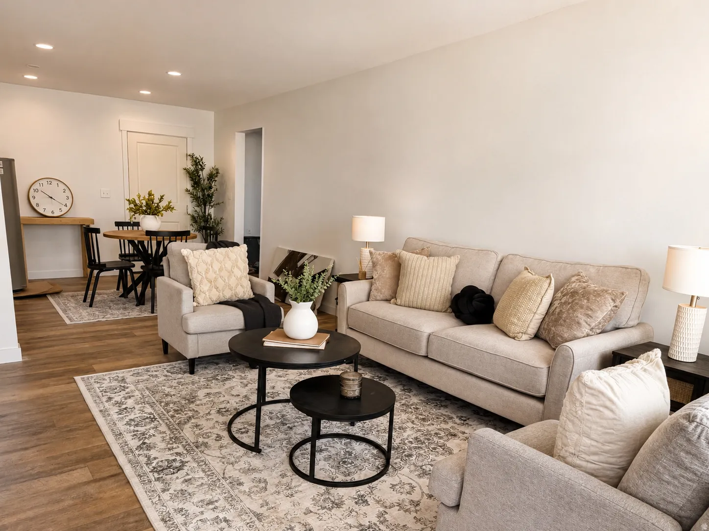 Open-concept living space with recessed lighting, wood-finish flooring, and light-toned walls