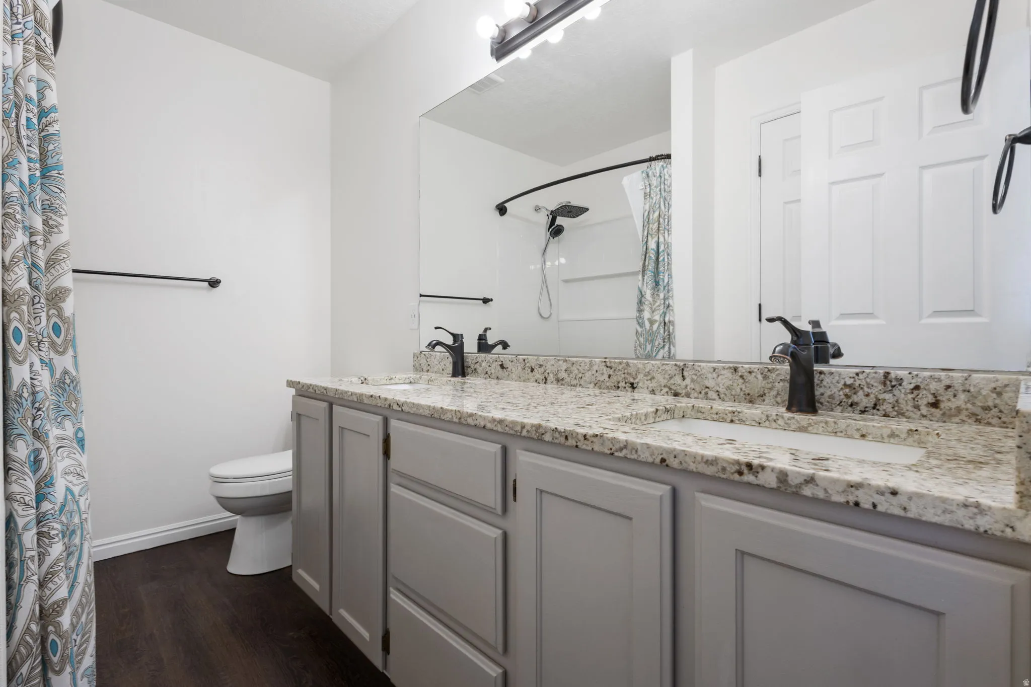 Double vanity with granite-style countertop and integrated sinks