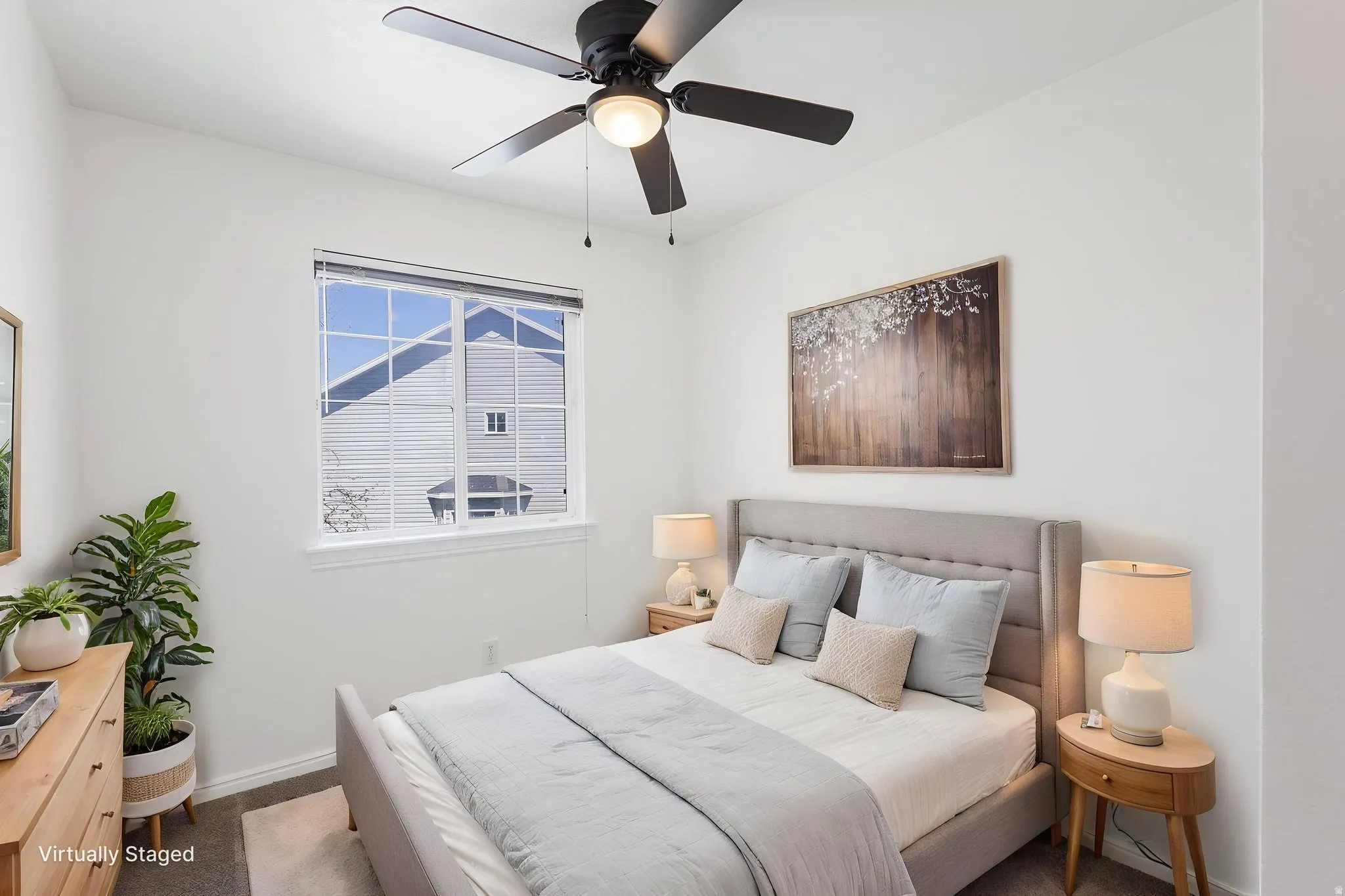 3rd Bedroom (Virtually staged)Bedroom featuring a large picture window, a ceiling fan with integrated lighting, and light-toned walls