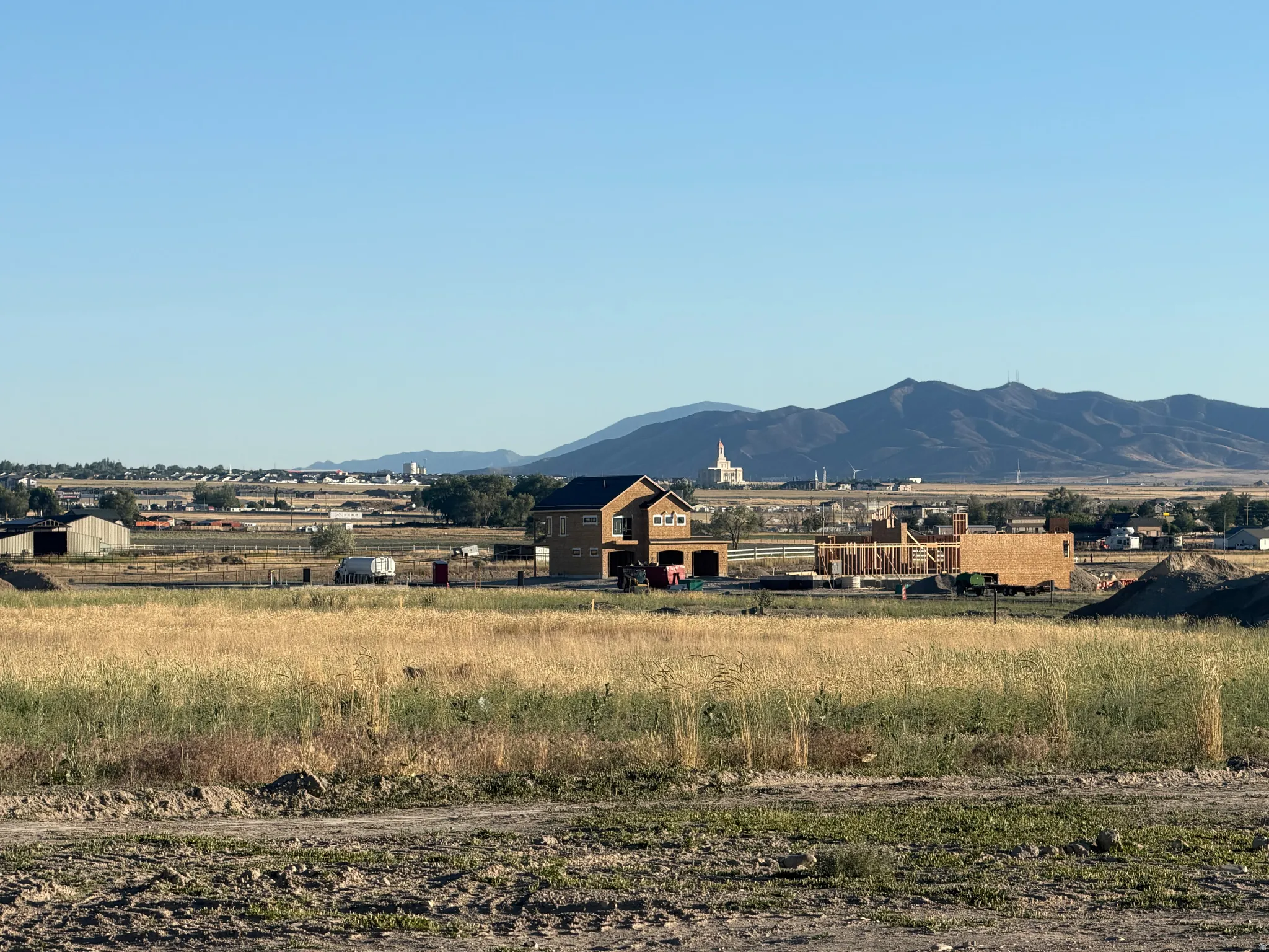 Expansive field with distant mountainous terrain