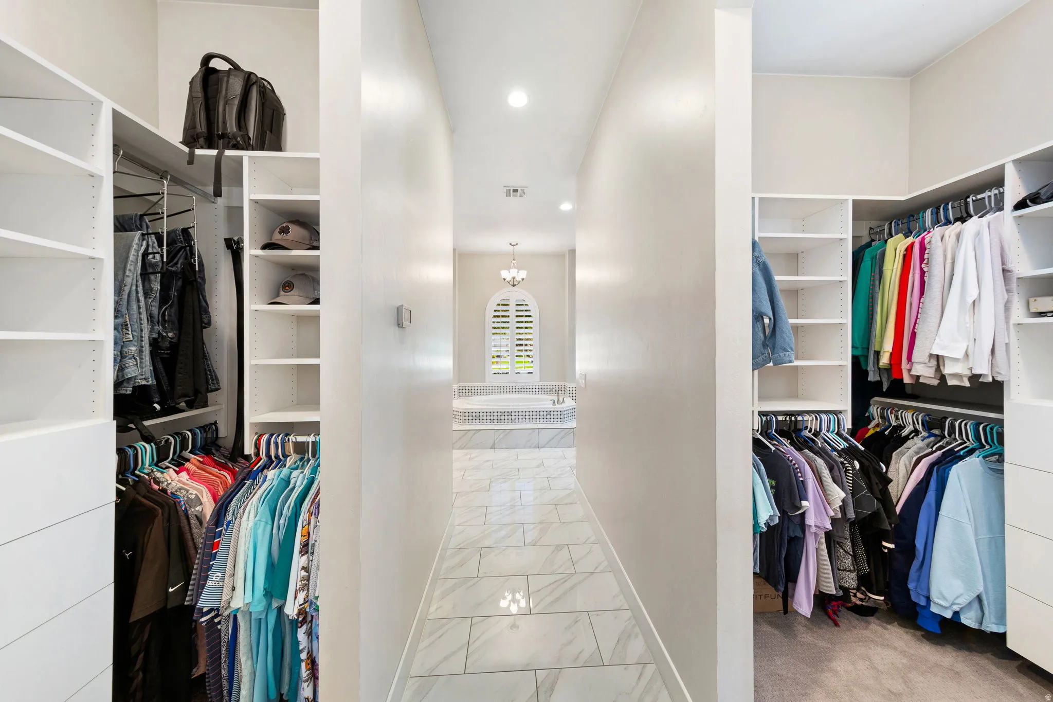 Custom closet systems with extensive shelving and hanging space