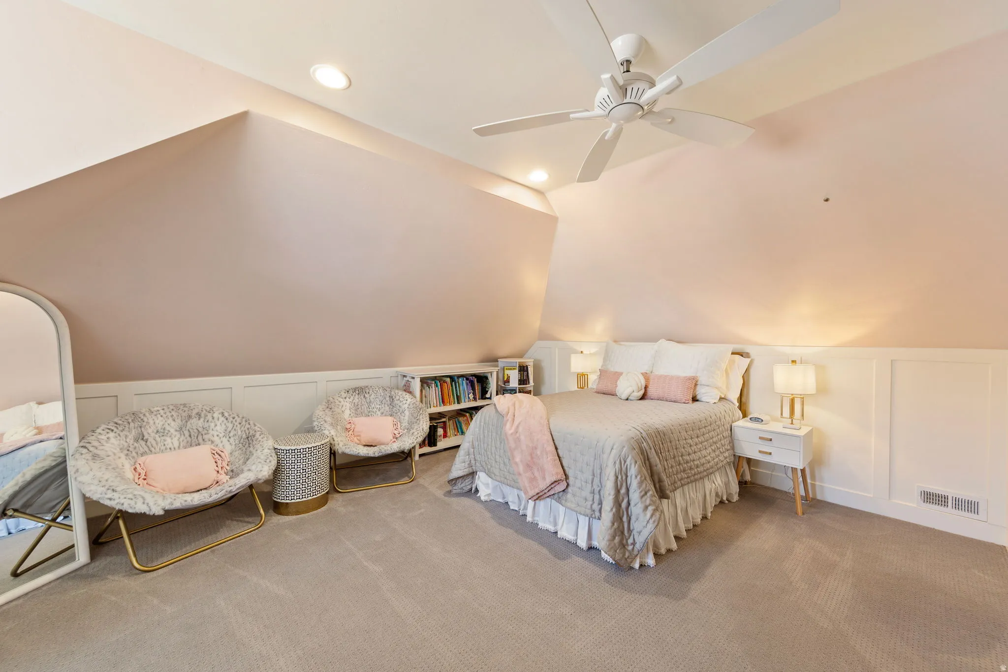 Carpeted room featuring a sloped ceiling, recessed lighting, and a ceiling fan