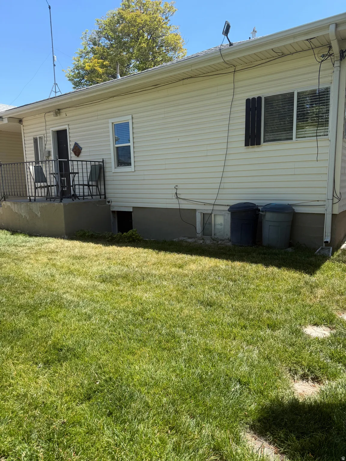 Outside basement entrance and large back porch.