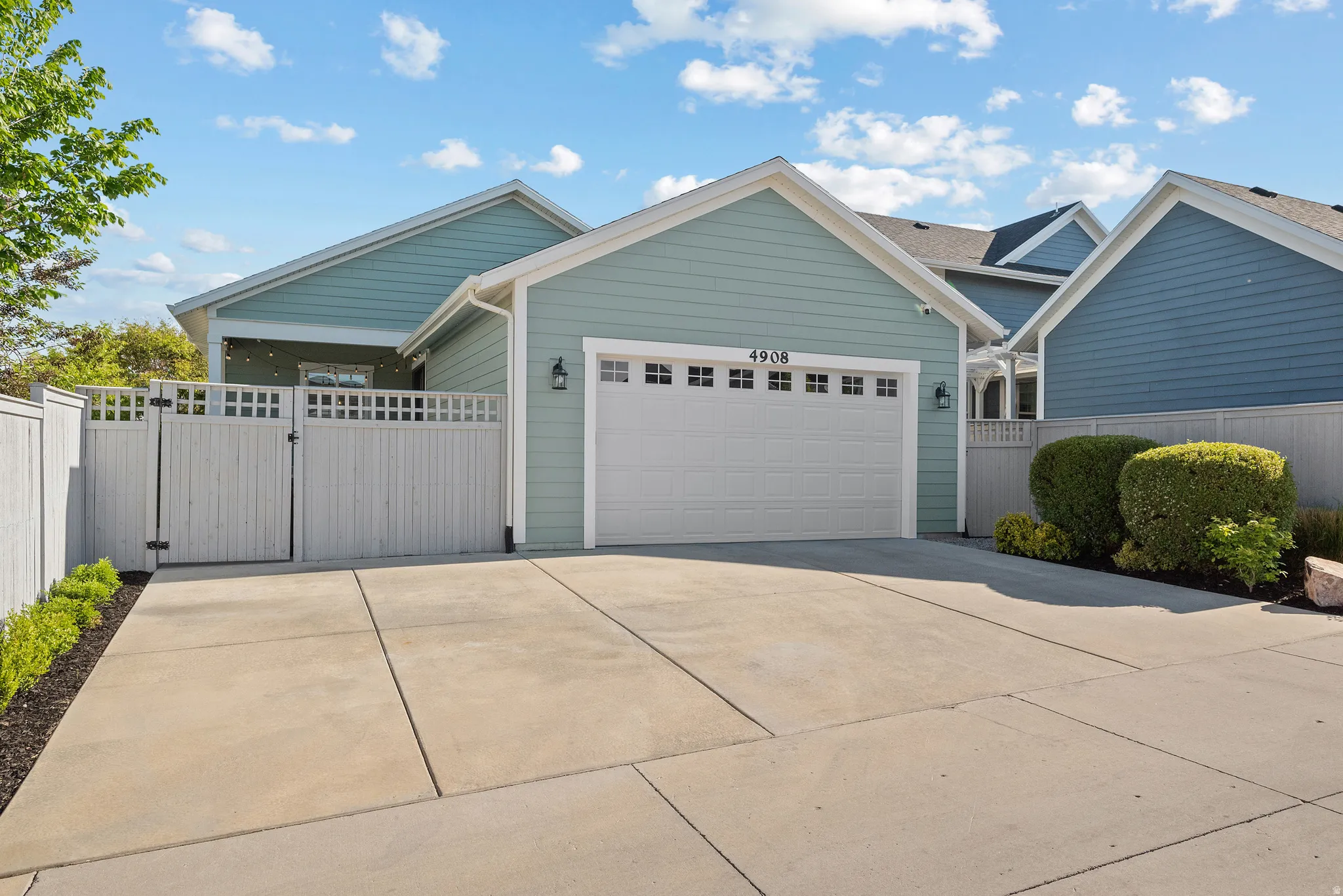 Single-car garage with a white door and decorative windows