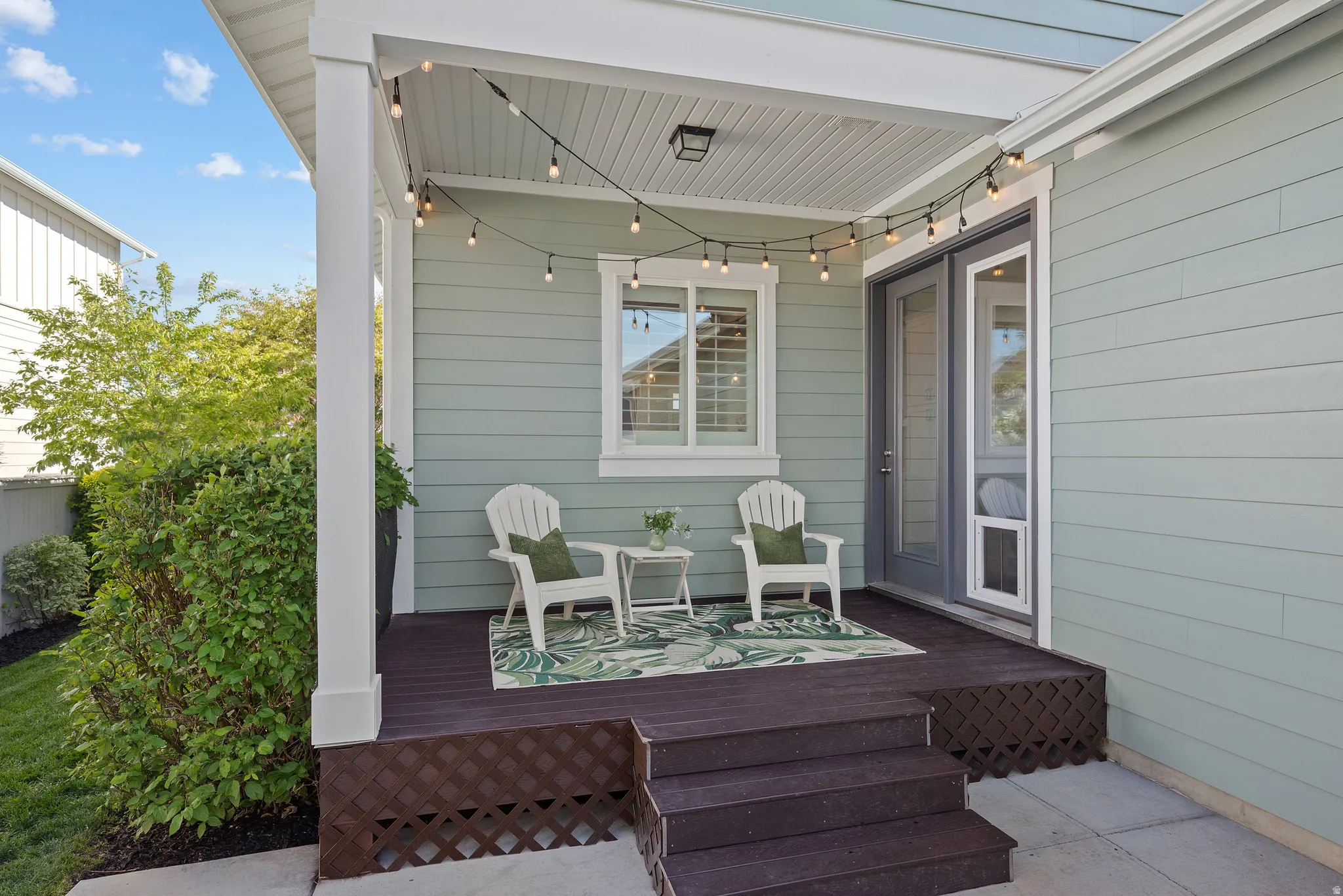 Covered porch featuring durable decking and lattice skirting