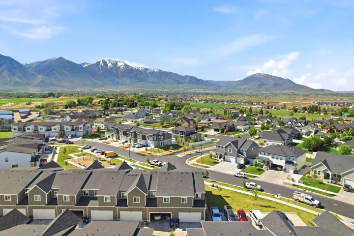 Residential community featuring single-family homes and townhomes with distinct architectural styles