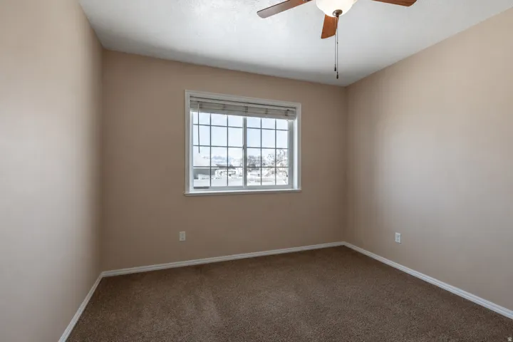 Neutral-toned walls and brown carpeting create a cohesive interior space