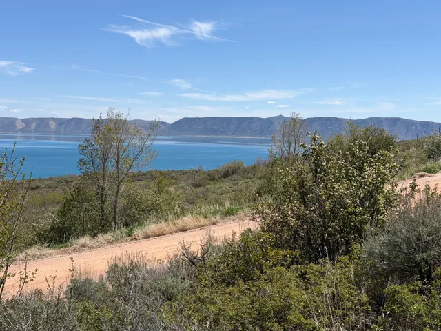 Expansive water body against a mountainous backdrop