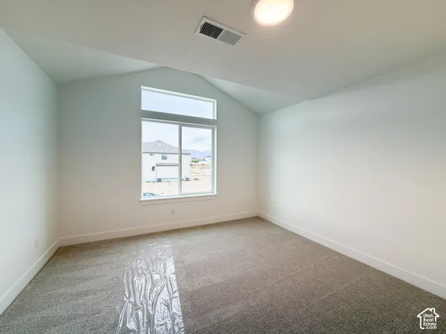 Vaulted ceiling with a large transom window, providing abundant natural light
