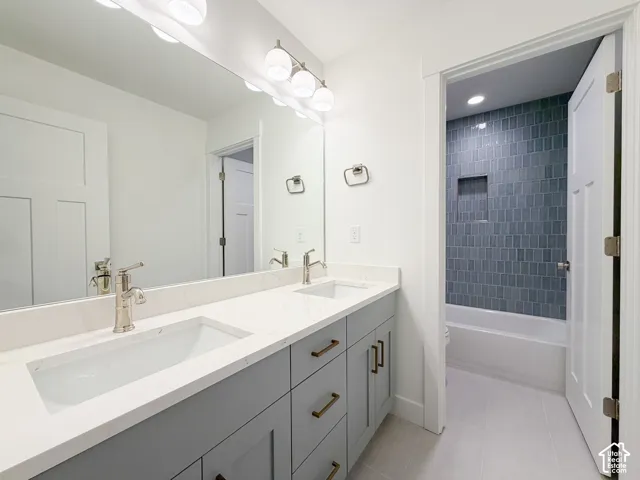 Double vanity with integrated rectangular sinks and brushed nickel faucets