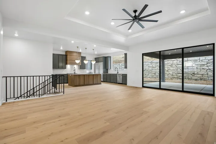 Wood-finish flooring, recessed lighting, and a modern ceiling fan