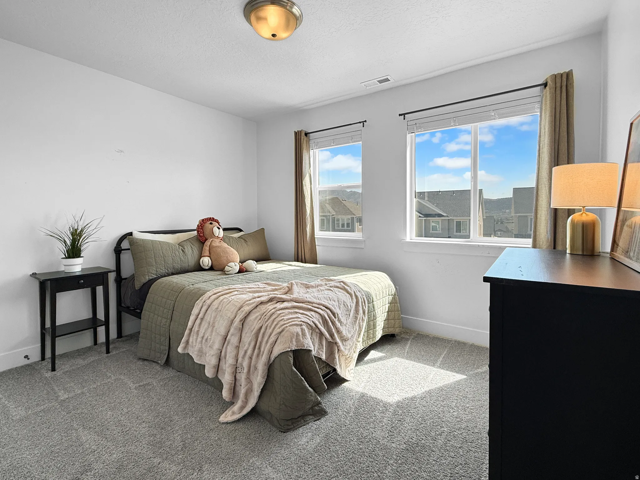 Bright interior room with two large windows