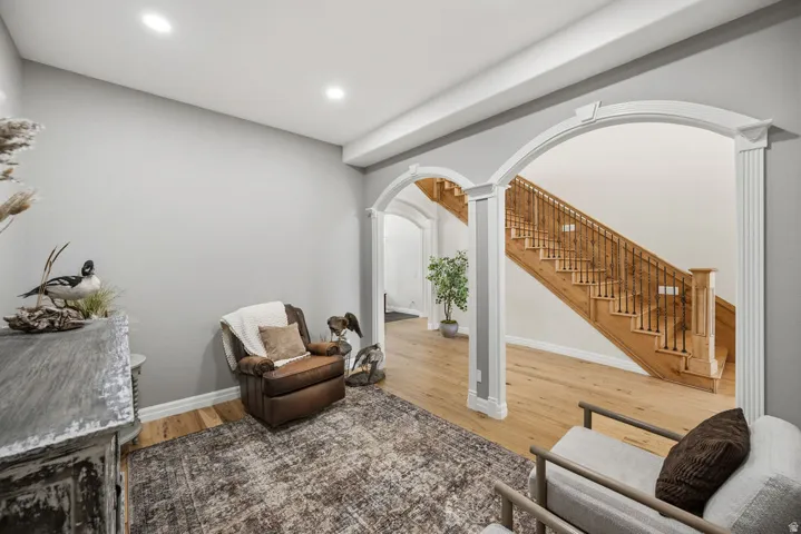 Arched entryway revealing a grand staircase / Formal Dining Room