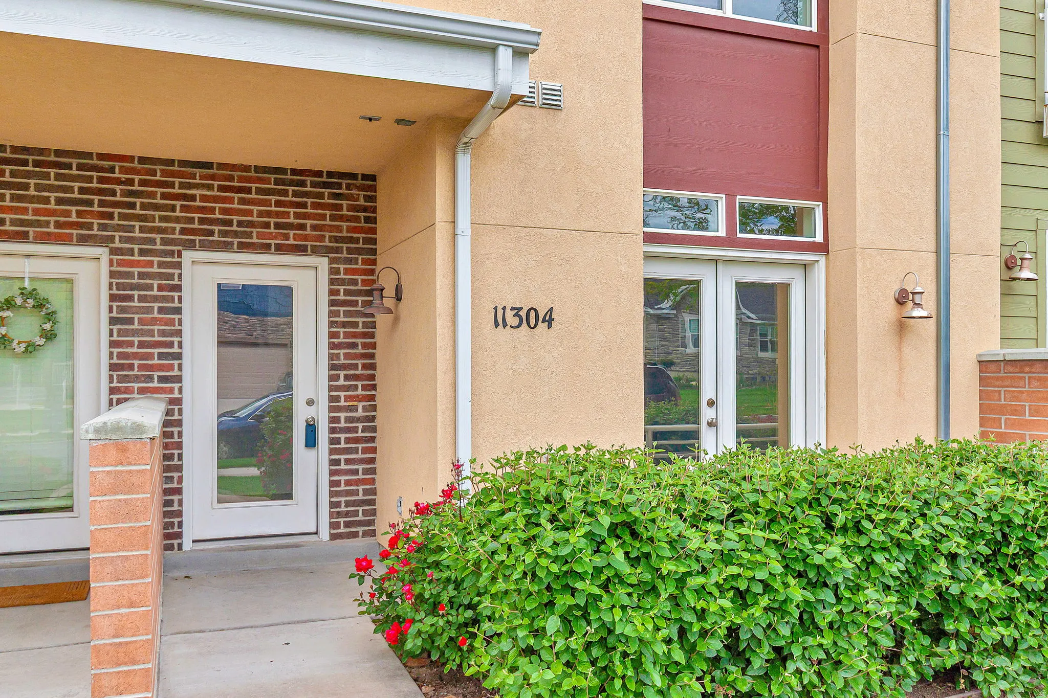 Stucco and brick exterior with contrasting trim