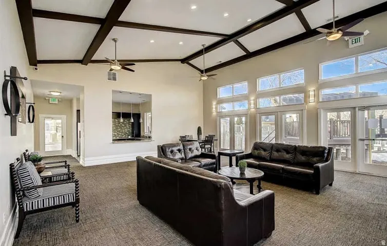 Vaulted ceilings with exposed beams and ceiling fans