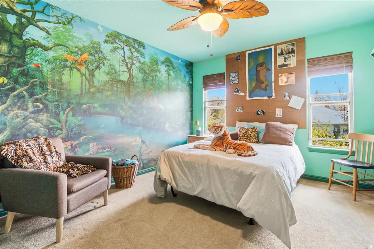 Accent wall featuring a detailed jungle mural