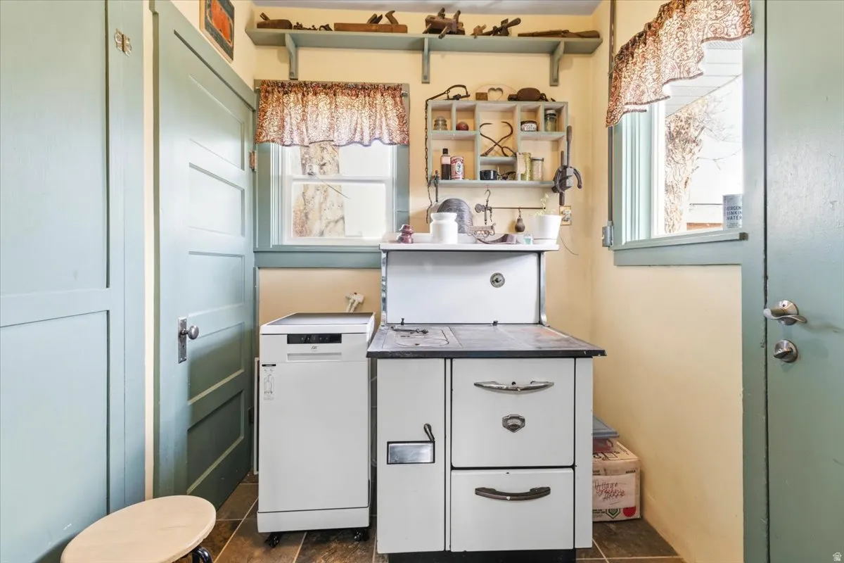 Vintage-style stove appliance paired with a portable dishwasher