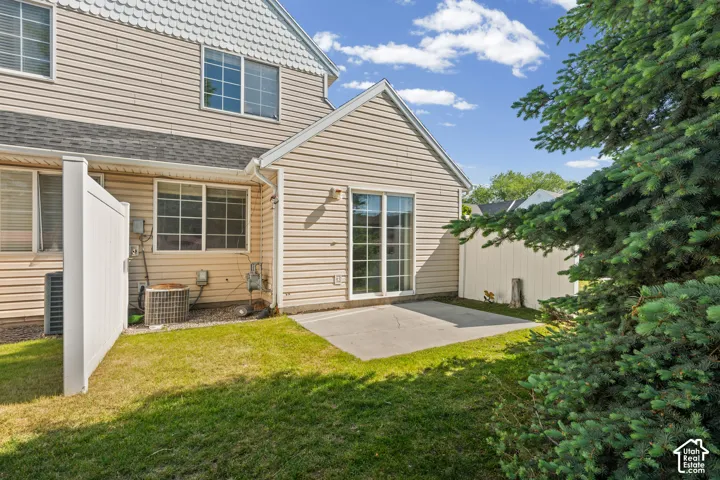Private outdoor patio with sliding glass door access to the interior