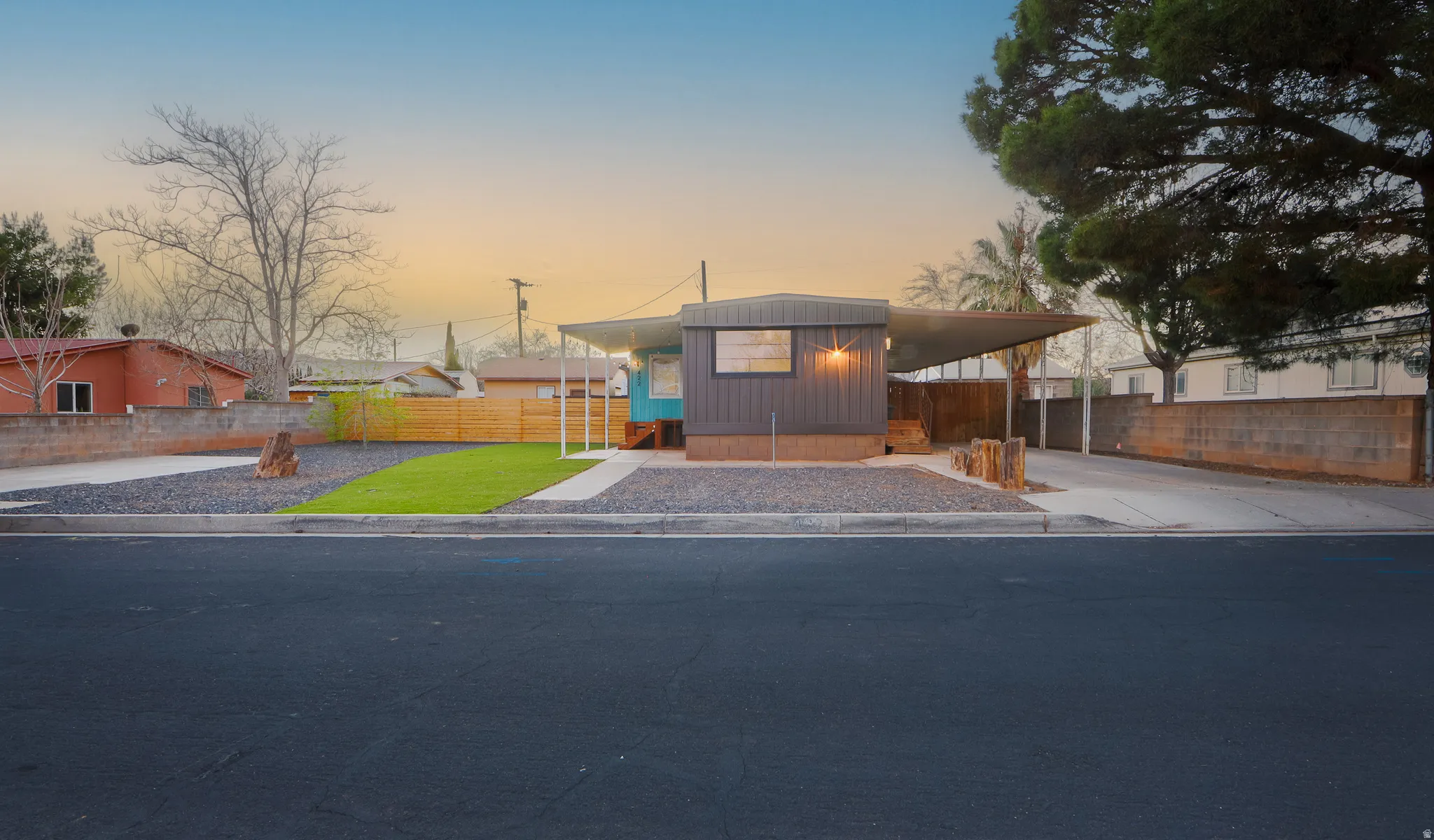 Manufactured / mobile home with an attached carport and driveway