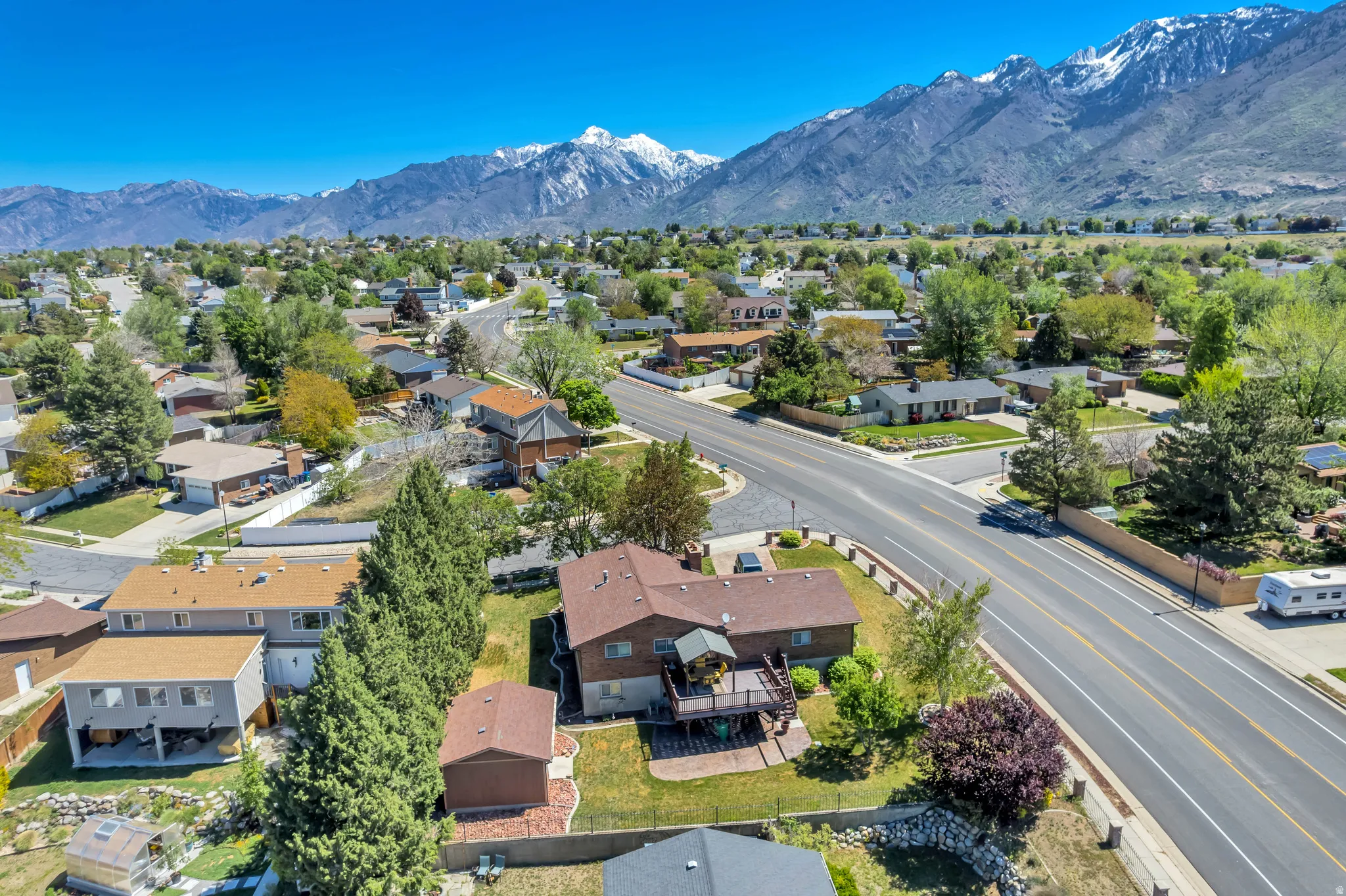 Residential neighborhood setting with prominent mountain range backdrop