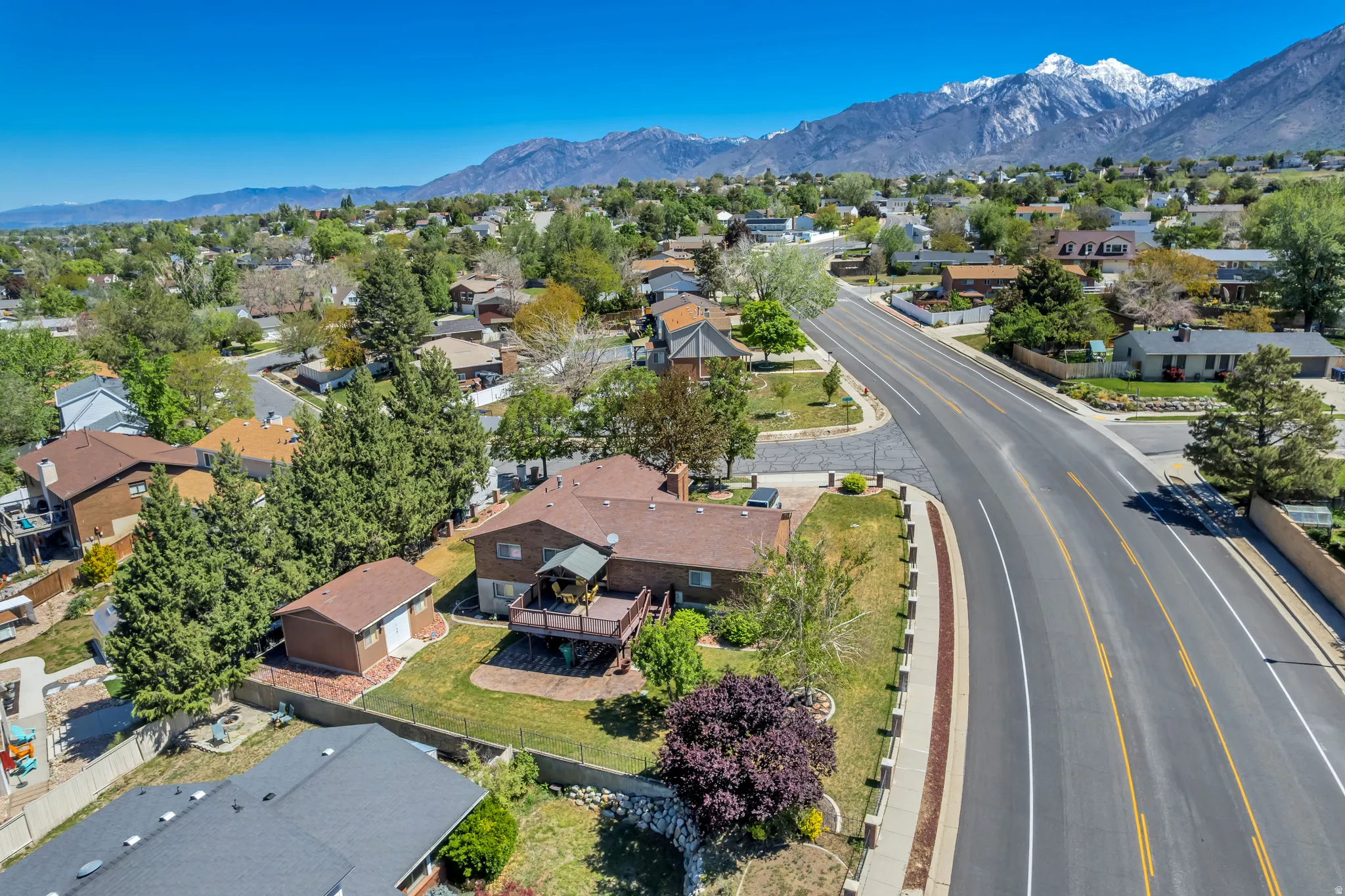 Property with a corner lot, a two-story deck, and an additional detached structure