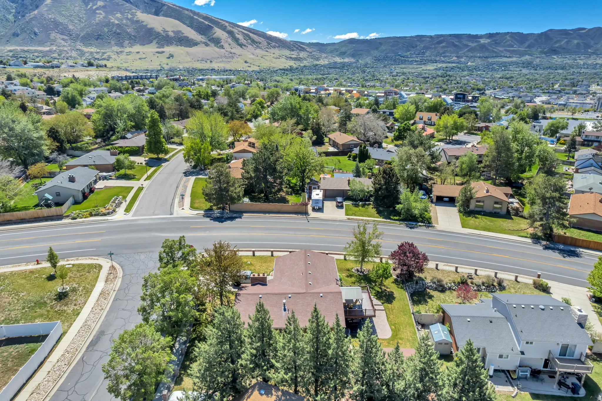Aerial perspective showcasing a residential area with varied home styles and mature landscaping