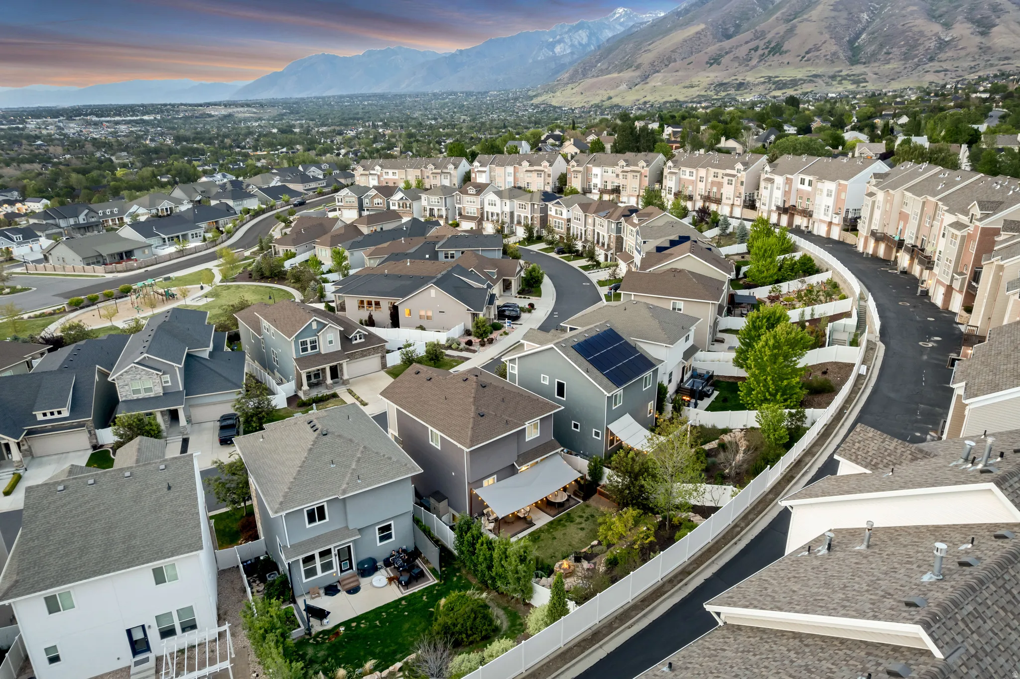 Expansive residential development featuring a variety of architectural styles, including multi-story townhomes and detached residences