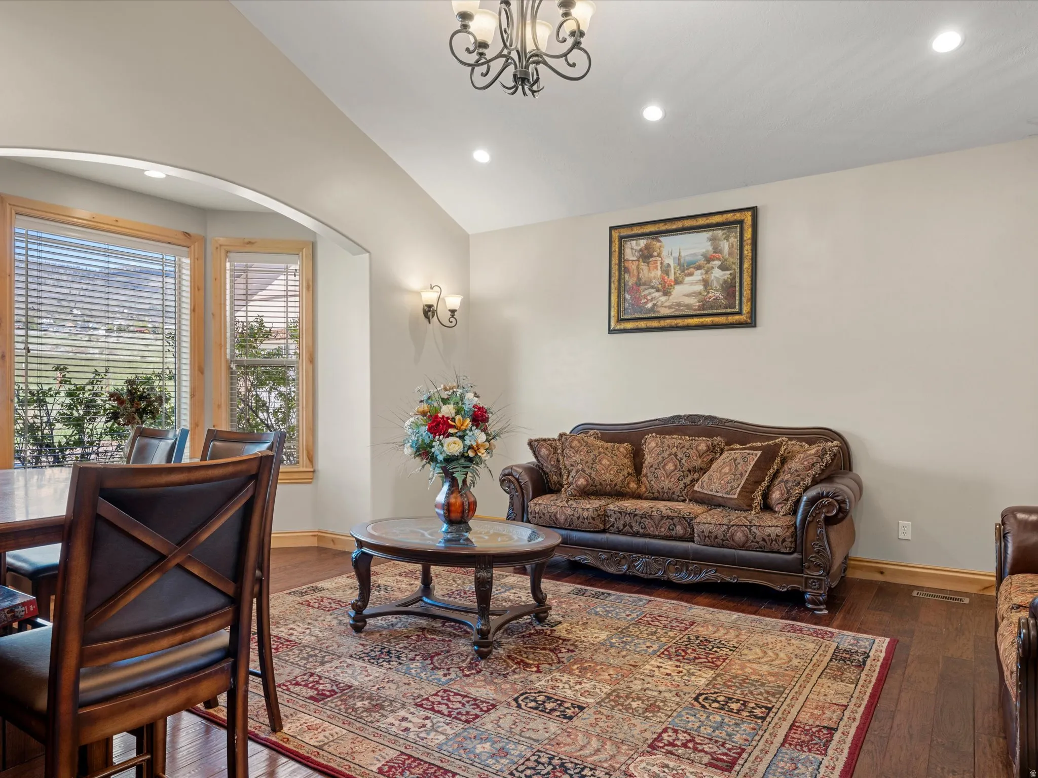 Formal living room a with bay windows and a cased opening
