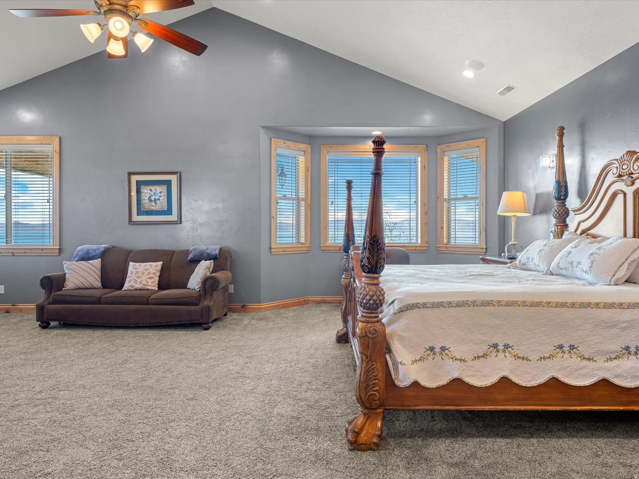 Primary bedroom, Spacious room featuring vaulted ceilings, recessed lighting, and a bay window