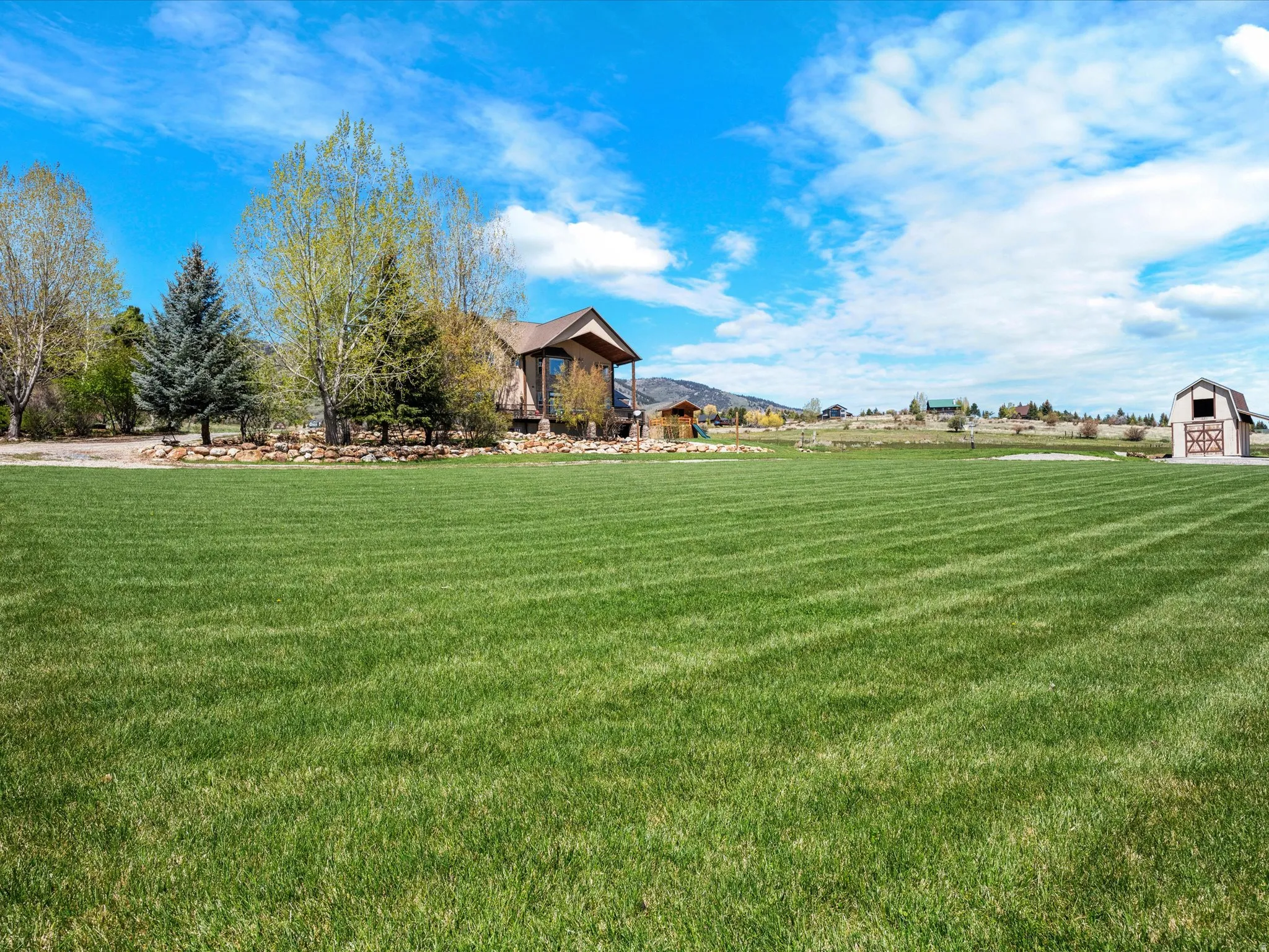 Expansive green lawn with visible mow lines