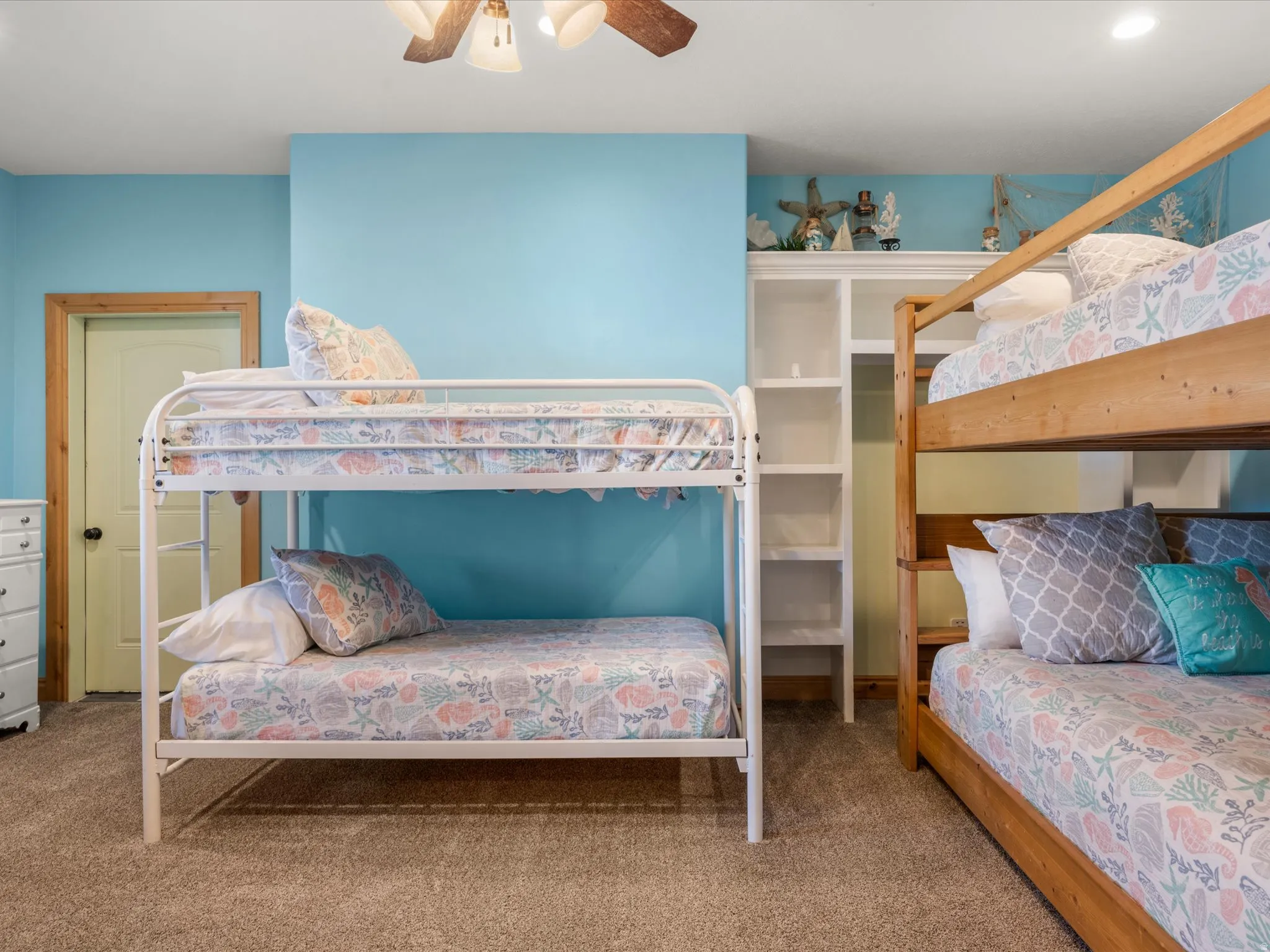 Carpeted room featuring light blue walls