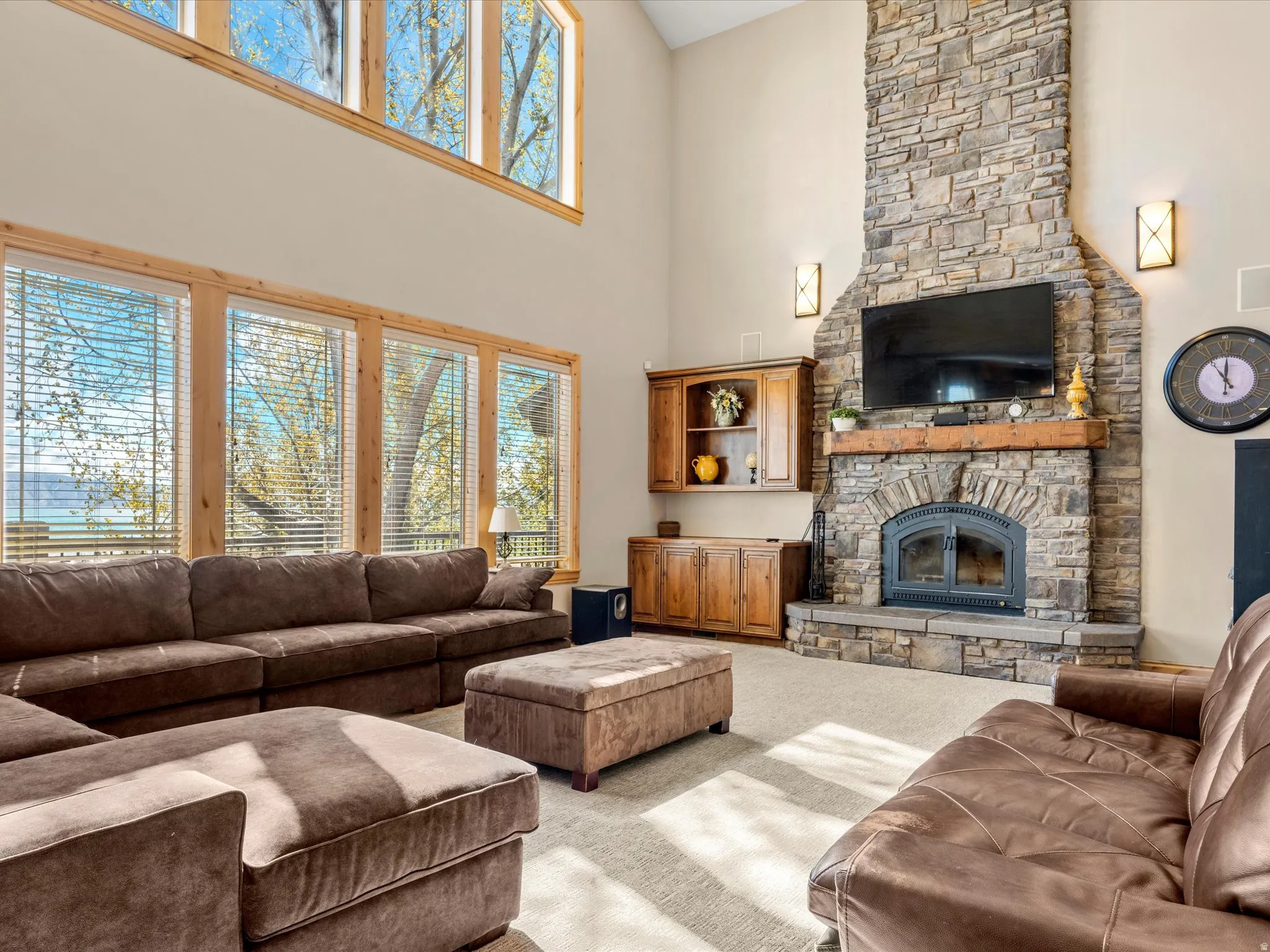 Spacious living area featuring a two-story ceiling and abundant natural light