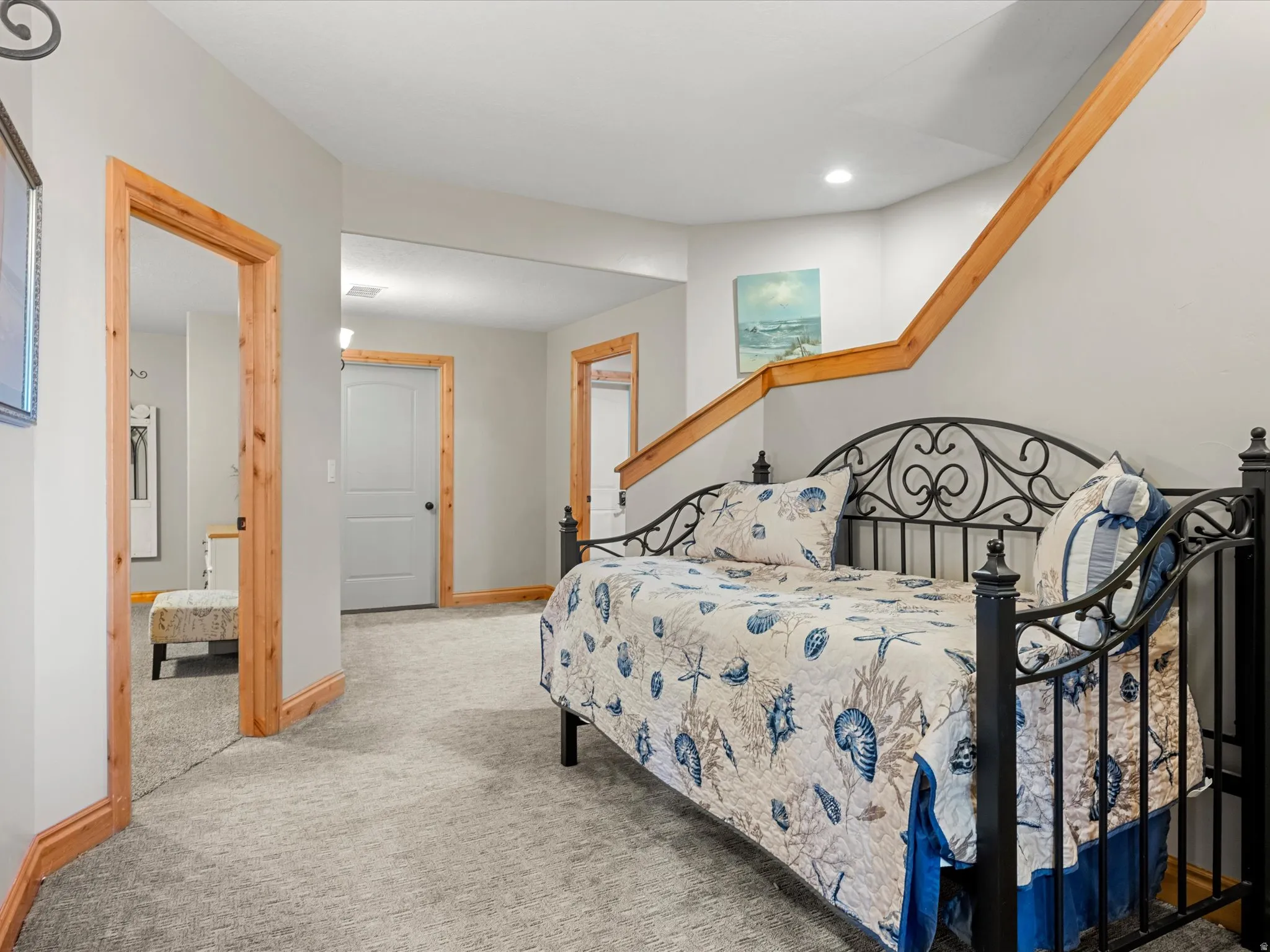 Finished lower level featuring light gray walls and plush gray carpeting